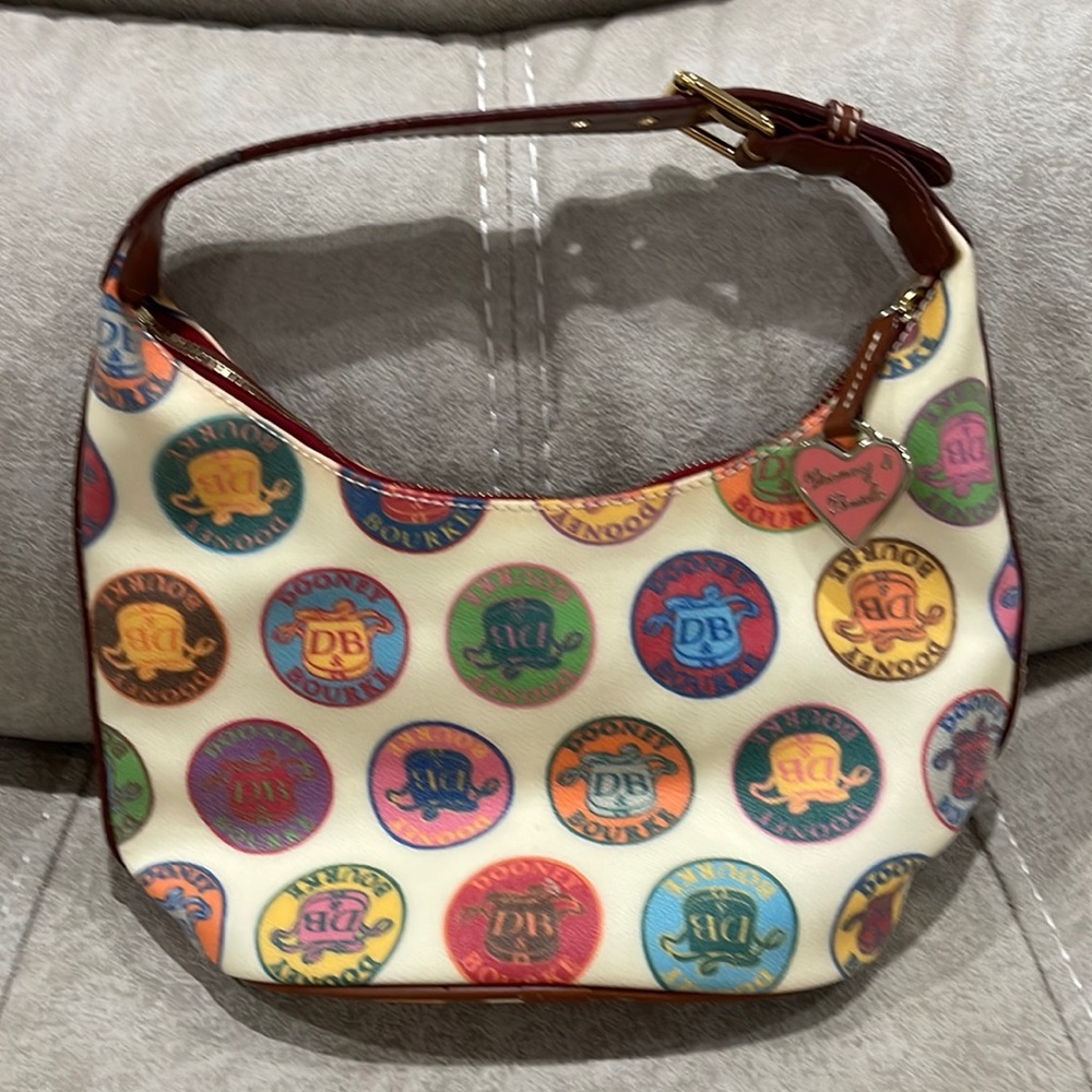 Dooney & Burke cream hobo bag with circle patch